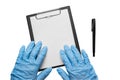 Hands in blue gloves lie on a clipboard on a white background