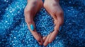 Hands Holding Blue Plastic Pellets.AI generated image Royalty Free Stock Photo