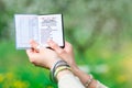 Hands with the book Japji Sahib. Prayer of the Sri Guru Granth S Royalty Free Stock Photo