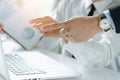 Hands of boss / manager and staff / employee pointing at computer screen together and briefing document for present to client Royalty Free Stock Photo