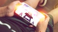 Hands of boy holding smartphone in his hand with three ladder and start button in screen Royalty Free Stock Photo