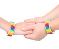hands with a bracelet patterned as the rainbow flag. isolated on white Royalty Free Stock Photo