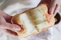 Hands breaking Fresh homemade Baked Japanese Soft and Fluffy Bun loaf of Bread or shokupan bread for Breakfast. Royalty Free Stock Photo