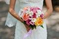 Hands of the bride beautiful wedding bouquet Royalty Free Stock Photo