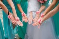 Hands of the bride and bridesmaids