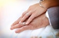 Hands of bride and groom holding each other showing rings Royalty Free Stock Photo