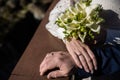 hands of bride and groom with rings. bride and groom . wedding bouquet table. bride and groom hold each other\'s hands. Royalty Free Stock Photo