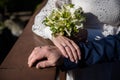 hands of bride and groom with rings. bride and groom . wedding bouquet table. bride and groom hold each other's hands. Royalty Free Stock Photo