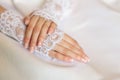 Hands of a bride with a wedding manicure Royalty Free Stock Photo