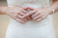 Hands of a bride at a wedding. pointing to the golden ring Royalty Free Stock Photo