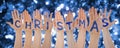 Hands Building Word Christmas, Glittering And Sparkling Bokeh Background