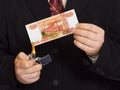 Hands and burnning russian money Royalty Free Stock Photo