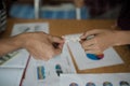 Hands of business people assembling jigsaw puzzle white. Below i Royalty Free Stock Photo