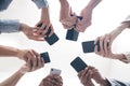 Hands, business people and phones in circle, low angle and teamwork for networking in office. Colleagues, website and Royalty Free Stock Photo