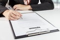 Hands of business woman signing the agreement document with pen Royalty Free Stock Photo