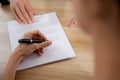 Hands of business woman signing and signature on contract about agreement with partner at office. Royalty Free Stock Photo
