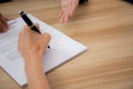 Hands of business woman signing and signature on contract about agreement with partner at office. Royalty Free Stock Photo