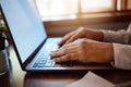 Hands of business woman typing on a laptop doing a online, internet or web search for company marketing research project