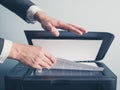 Hands of businessman copying document