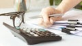 Hands of businessman hold pen for work in stacks Royalty Free Stock Photo