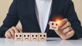 Hands of businessman pick up selection wooden cube blocks with smile emotion icons and not selected unhappy emotion. Royalty Free Stock Photo