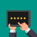 Hands businessman points to tablet with rating five stars