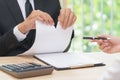 Hands of businessman ripping agreement paper when woman giving a