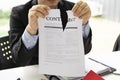 Hands of businessman ripping contract agreement paper,contract canceled,