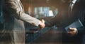 Businessman in suit having handshaking for business deal