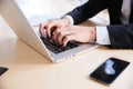 Hands of businessman using laptop and blank screen cell phone Royalty Free Stock Photo