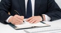 Hands of a businessman writing a schedule or recording ideas in a diary Royalty Free Stock Photo