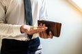 The hands of businessmen holding coins and wallets to save money, expand a growing business to success and save for retirement Royalty Free Stock Photo