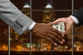 Hands of businessmen passing money. Royalty Free Stock Photo