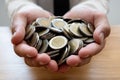 The hands of businessmen who hold coins to save money, expand a growing business to success and save for retirement concepts Royalty Free Stock Photo