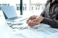 The hands of businessmen who hold coins to save money, expand a growing business to success and save for retirement concepts Royalty Free Stock Photo