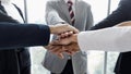 Hands of businesspeople stacked together in the symbol of unity and trust in same team Royalty Free Stock Photo