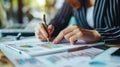 Hands of businesswoman examining graph at desk, Financial advisor and accounting concept