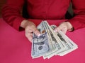 hands of a businesswoman holding american dollars banknotes Royalty Free Stock Photo