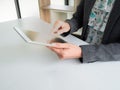 Hands of businesswoman using tablet in an office. Isolate the hand poining or tuching on the screen of smart technology. working