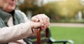 Hands, cane and elderly man in nature for walking for fresh air, exercise or peace in a park. Environment, closeup and