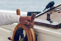 Hands of the captain holding the wheel on the deck of the ship Royalty Free Stock Photo