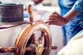 The hands of the captain and a steering wheel boat port services. Sea and travel concept Royalty Free Stock Photo