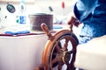 The hands of the captain and a steering wheel boat port services. Sea and travel concept Royalty Free Stock Photo