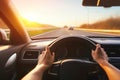 Hands of a Car Driver on the Steering Wheel during a Road Trip. Generative AI Royalty Free Stock Photo