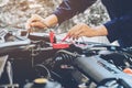 Hands of car mechanic working in auto repair service. Royalty Free Stock Photo