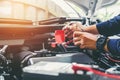 Hands of car mechanic working in auto repair service. Royalty Free Stock Photo