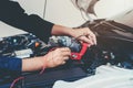 Hands of car mechanic working in auto repair service. Royalty Free Stock Photo