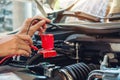 Hands of car mechanic working in auto repair service. Royalty Free Stock Photo