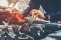 Hands of car mechanic working in auto repair service. Royalty Free Stock Photo