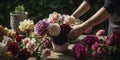 Hands carefully arrange a beautiful floral arrangement, creating a stunning centerpiece for an open-air garden party